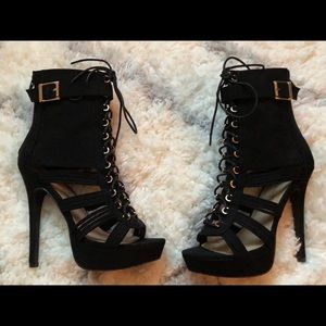 Black lace up heels with gold buckles